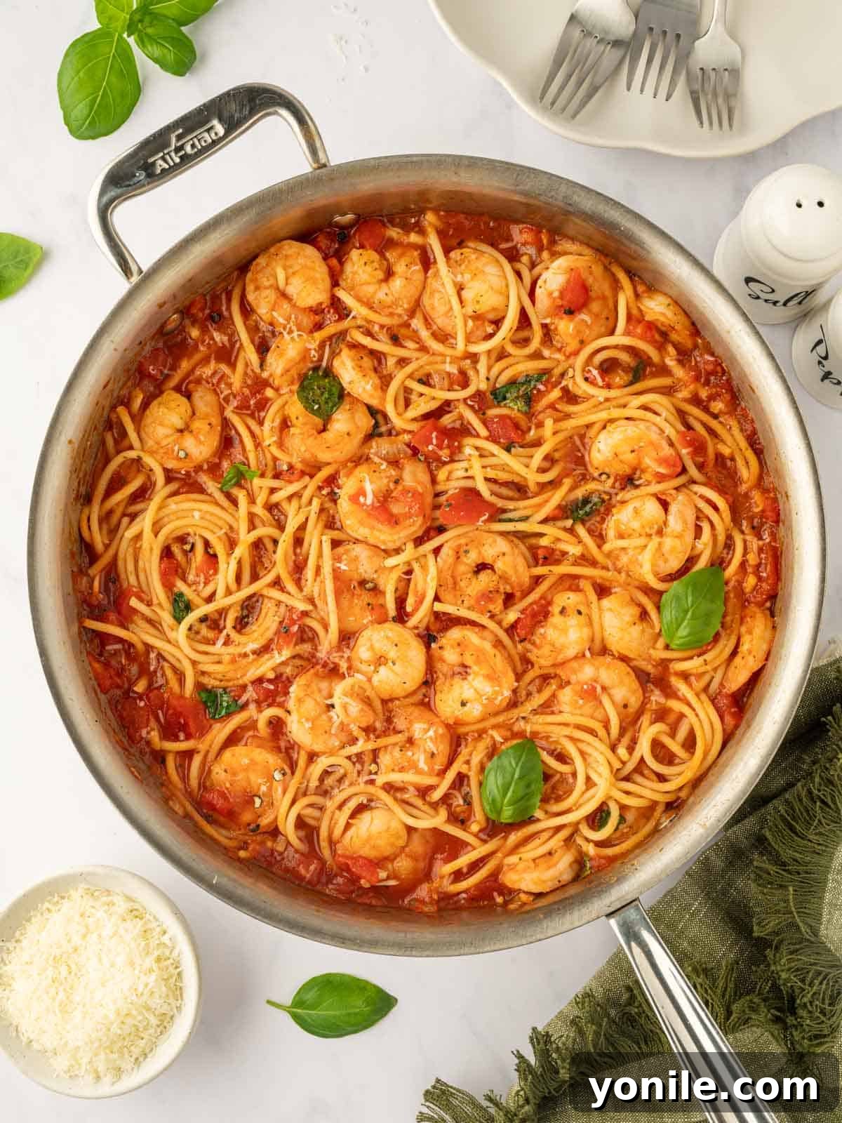 Prawn Pasta Perfection 11 A large skillet brimming with red sauce, perfectly cooked spaghetti, and succulent shrimp.
