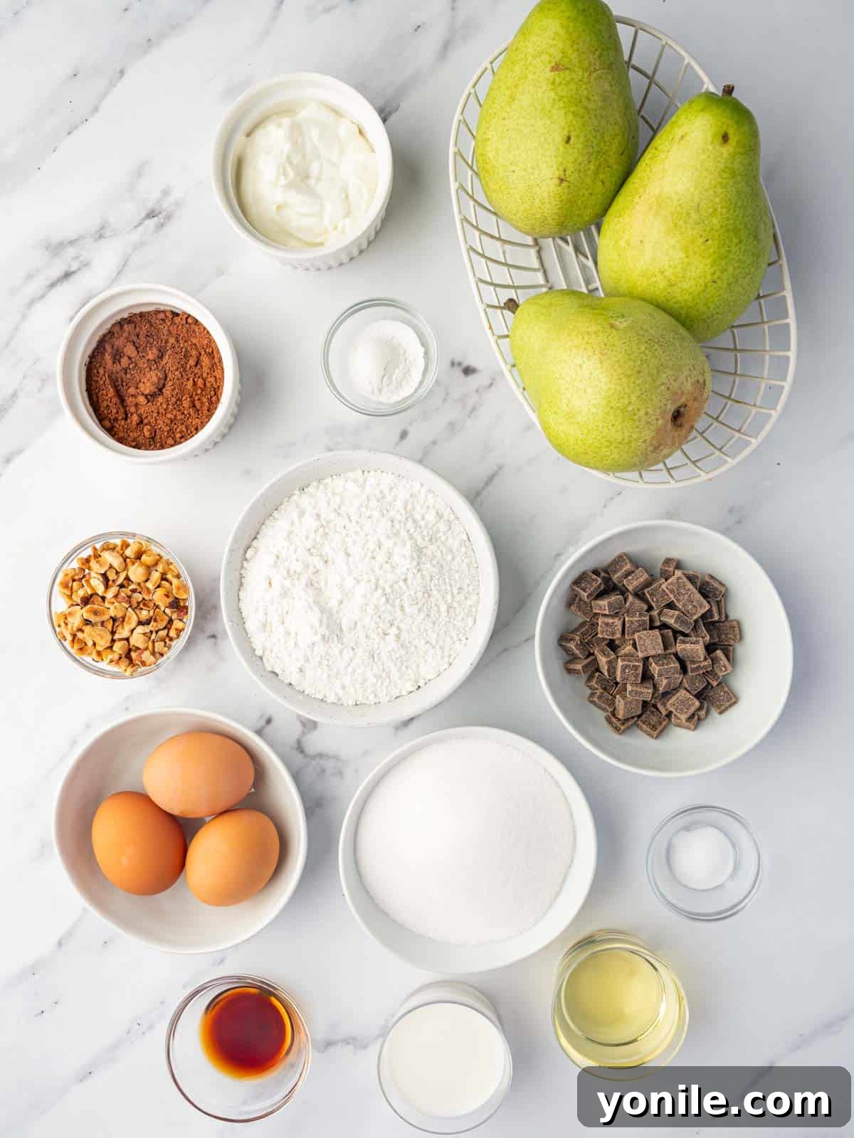 All ingredients for Chocolate Pear Cake laid out on a counter.