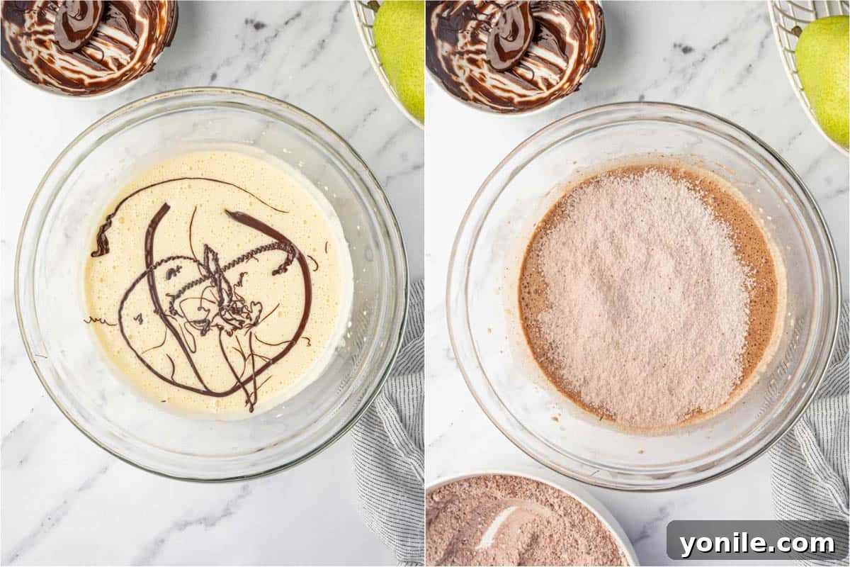 Chocolate pear cake batter being combined in a bowl.