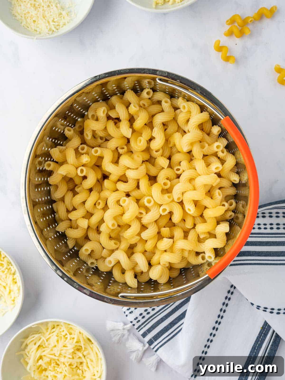 Cooked pasta in a strainer.