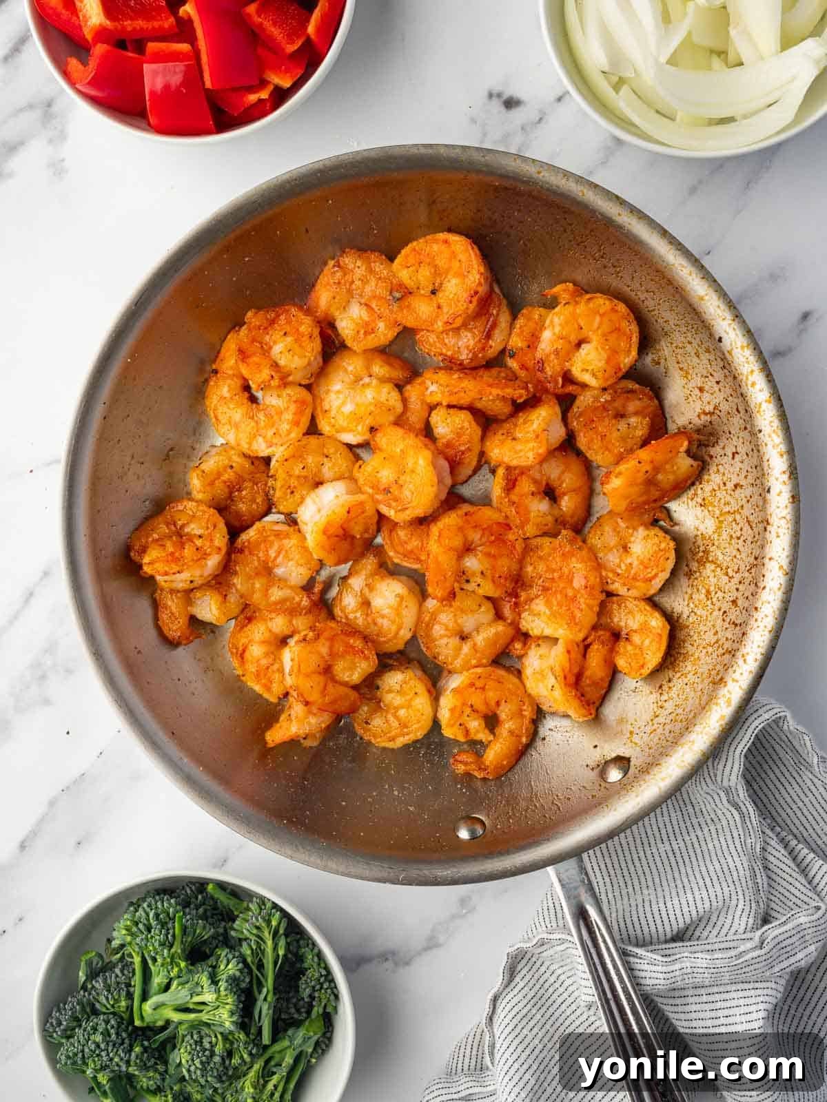 Panda Express Wok-Fired Sizzling Shrimp 6 Shrimp frying in a hot skillet, achieving a perfect golden-brown crispness.
