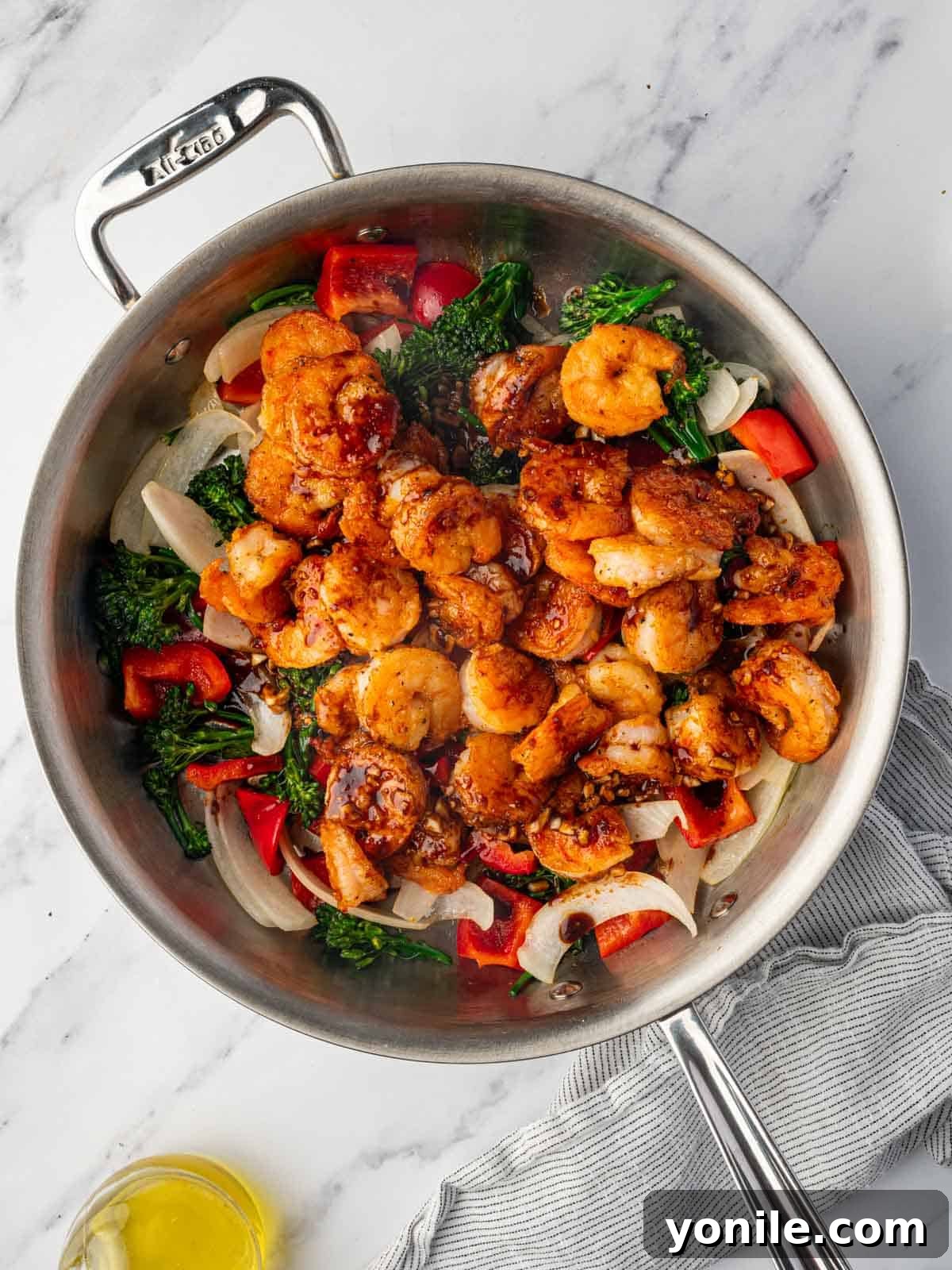 Panda Express Wok-Fired Sizzling Shrimp 9 A skillet full of cooked shrimp and colorful vegetables, generously coated in the rich, red sizzling sauce.