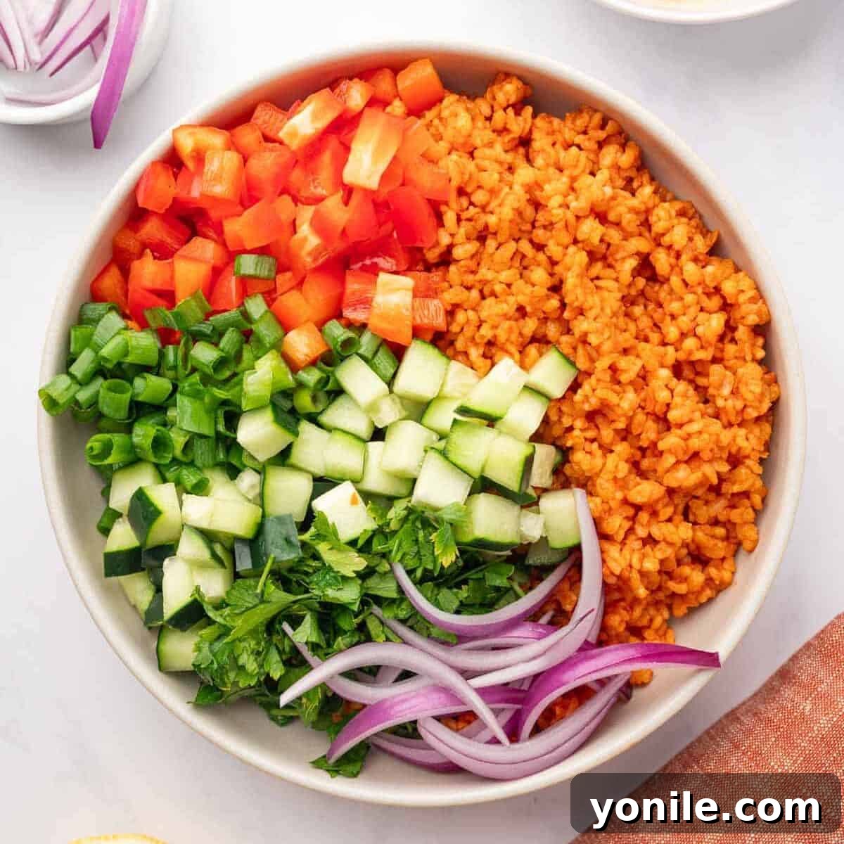 Vibrant Turkish Kisir Salad 10 All the finely chopped fresh vegetables and herbs, along with the bulgur mixture, gathered in a large mixing bowl, ready for the final dressing and combine.