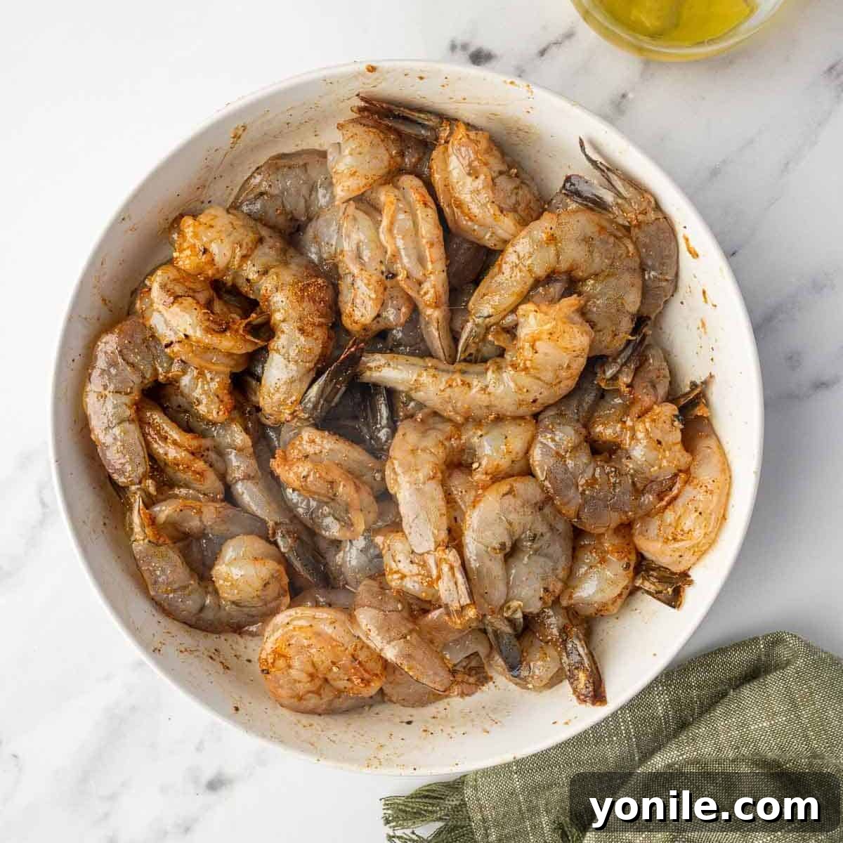 Fiery Cajun Shrimp Scampi with Linguine 4 Marinated cajun shrimp in a bowl.