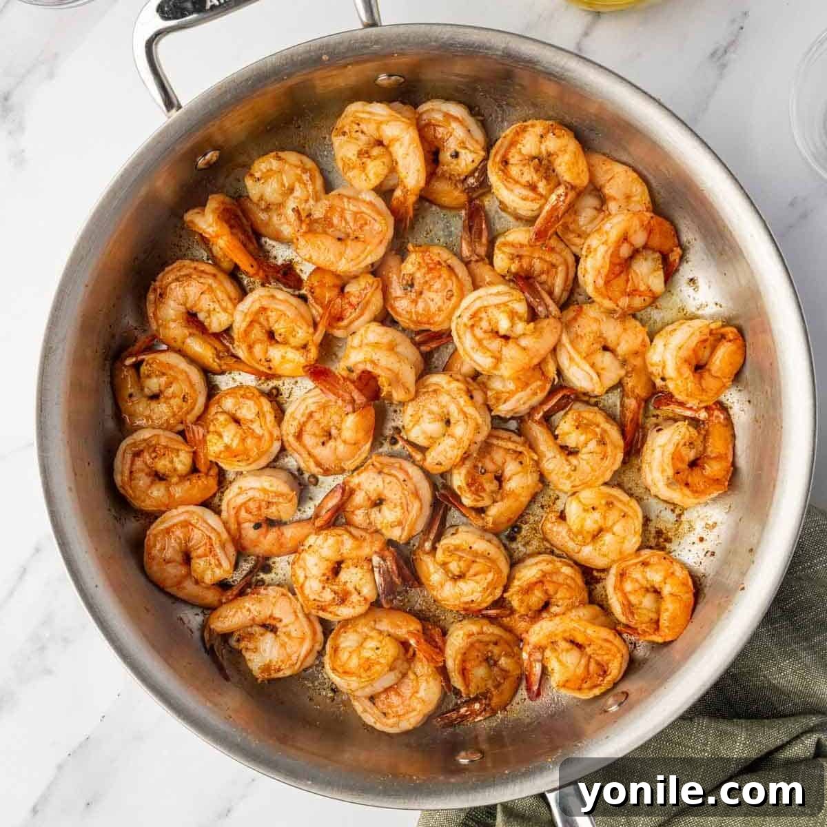 Fiery Cajun Shrimp Scampi with Linguine 5 Saute shrimp in a skillet with cajun seasoning.