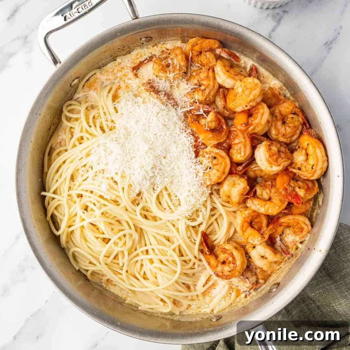 Fiery Cajun Shrimp Scampi with Linguine 8 Combining cajun shrimp with pasta and parmesan in a skillet.