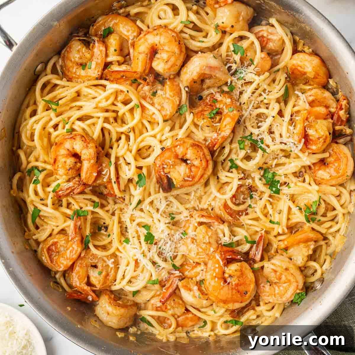 Fiery Cajun Shrimp Scampi with Linguine 9 A skillet with spaghetti and spicy shrimp ready to serve.