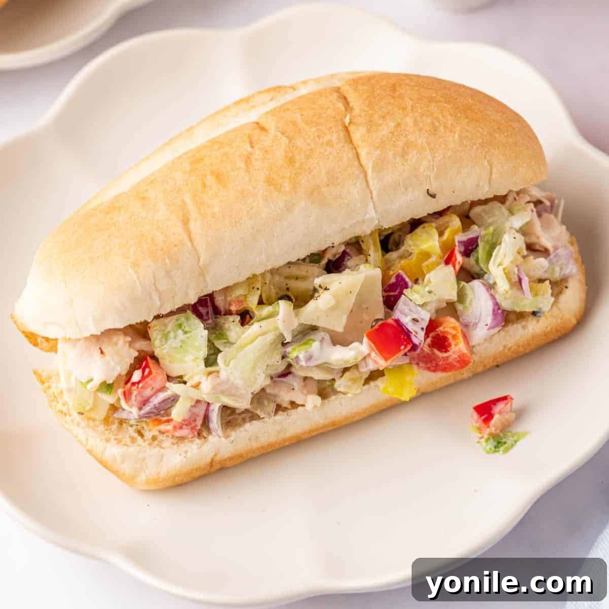 Zesty Chopped Italian Hero 7 A sub roll filled with the delicious chopped veggies and meats, ready to be eaten.