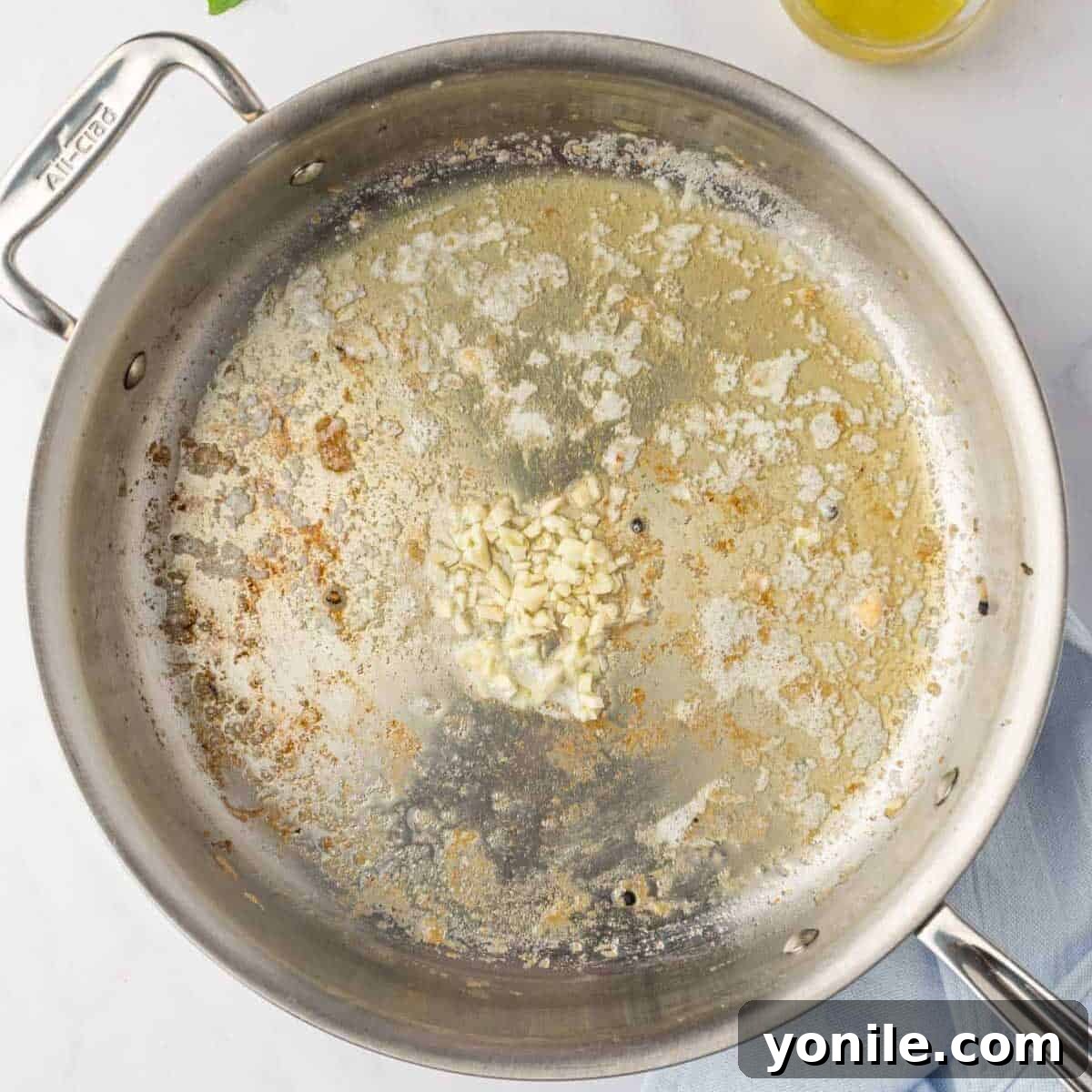 Proposal Chicken Pasta 6 Minced garlic and melting butter in a skillet, forming the base of the creamy sauce.
