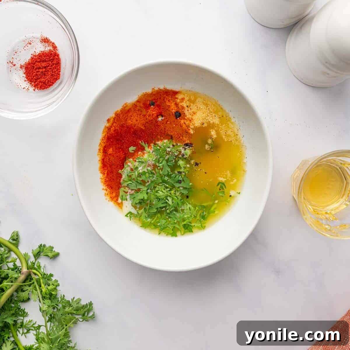 A vibrant lemon butter sauce mixture in a bowl, ready for basting.
