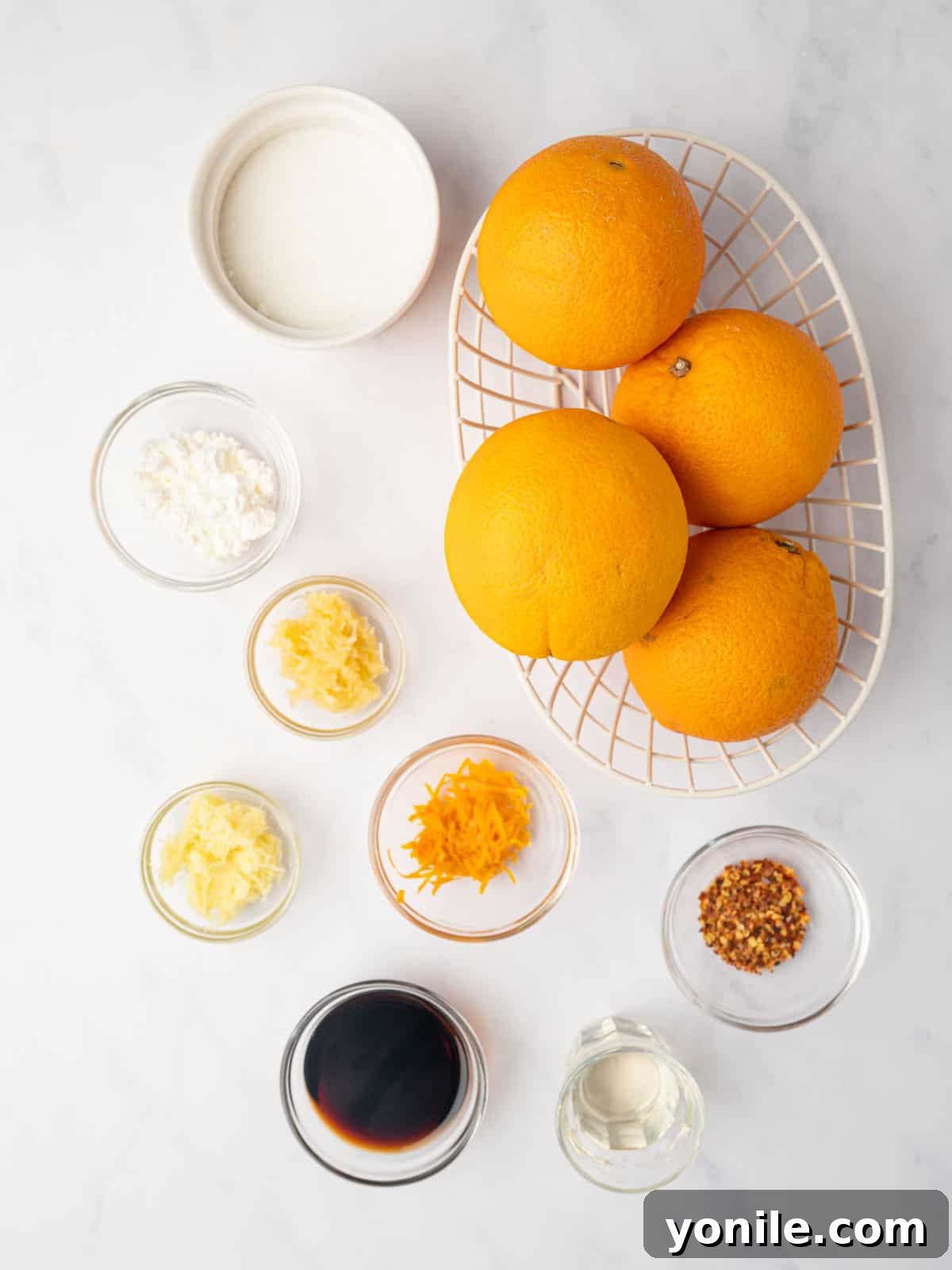 Ingredients needed for homemade orange chicken sauce, neatly arranged on a counter.