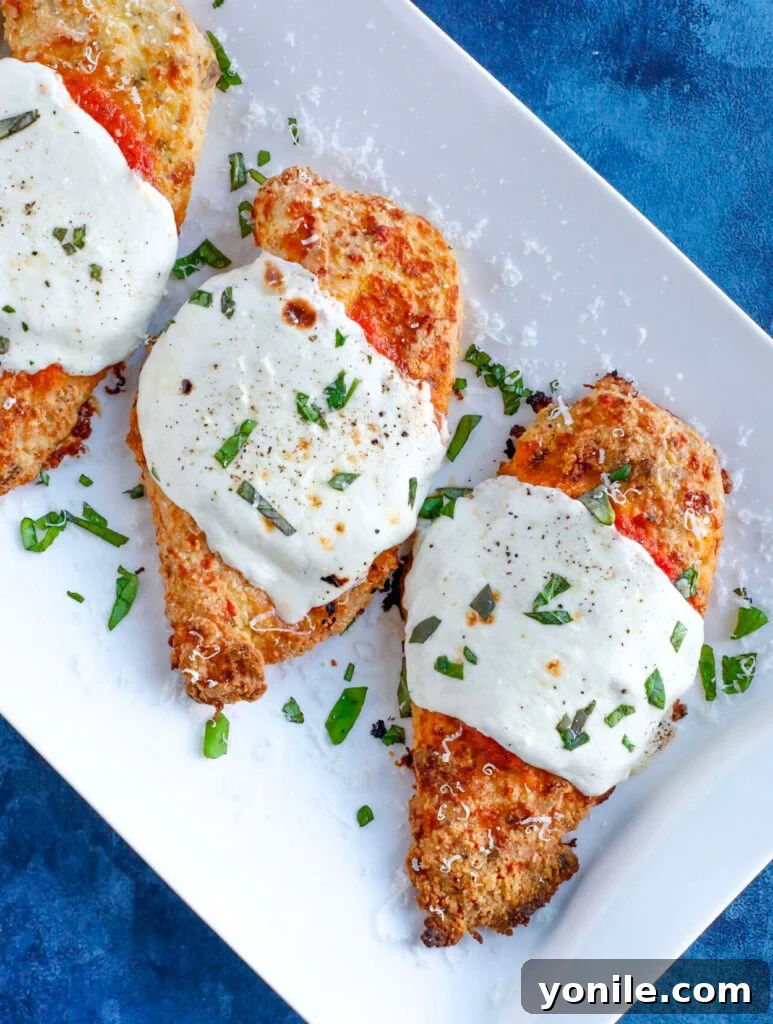 Baked parm chicken with marinara sauce and cheese