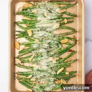 Garlic parmesan green beans baked on a tray.