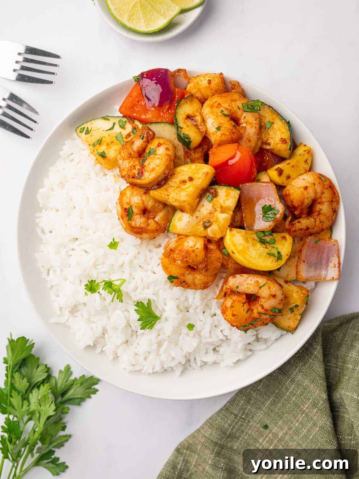 Shrimp and vegetable skillet meal served over white rice.