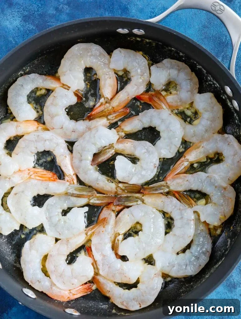 Garlic Shrimp Garlic shrimp cooking in a skillet with spices