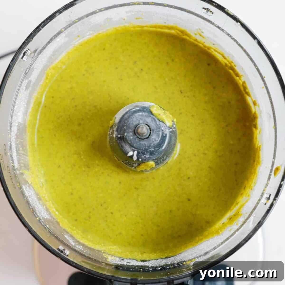 Finished pistachio cream in a food processor.