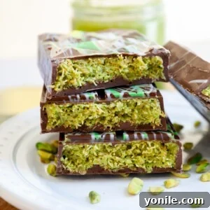 Dubai Chocolate Bar split in half and stacked on top of each other, showcasing the crispy pistachio filling.