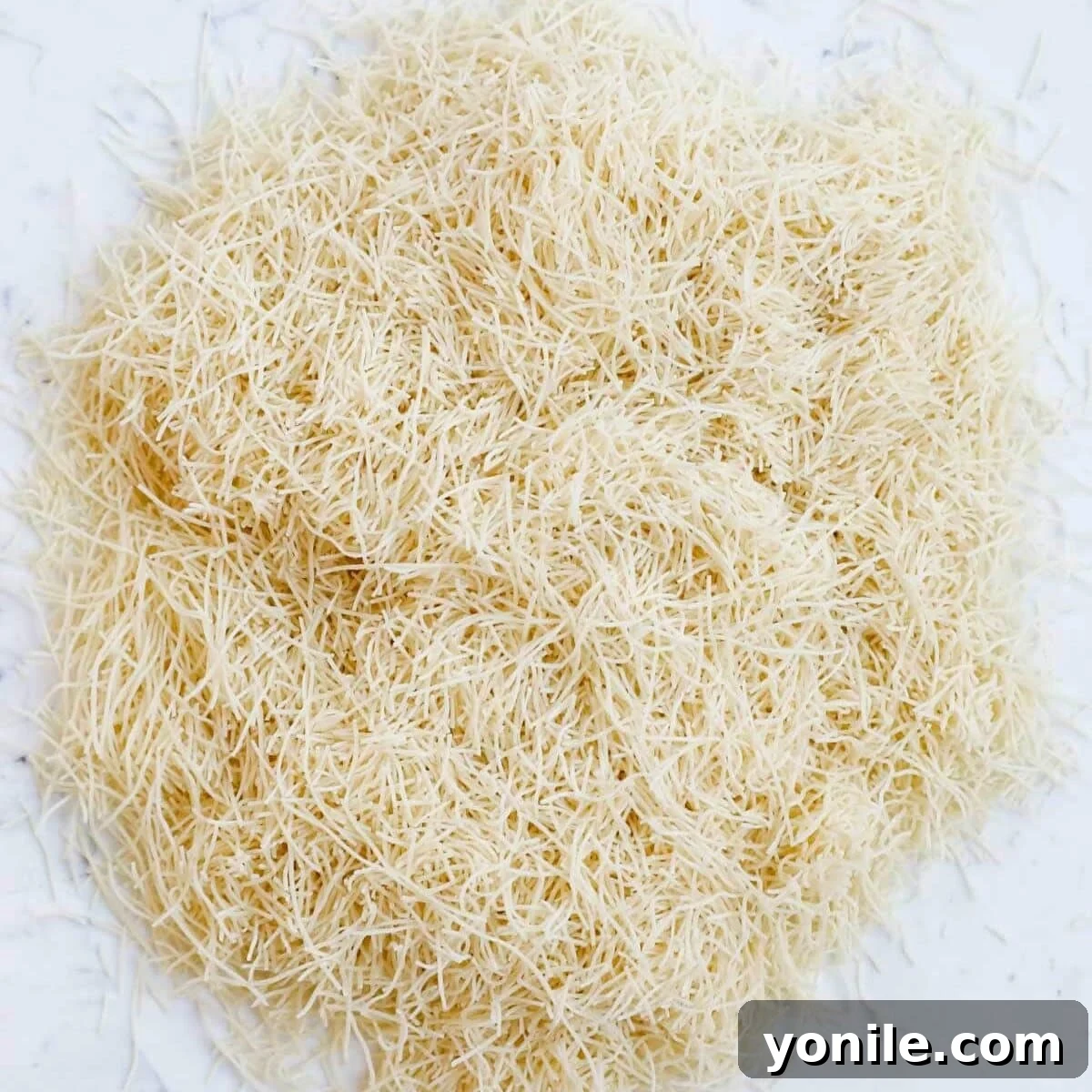 Emirate's Indulgence Bar 4 Raw shredded Kataifi dough, ready for preparation.