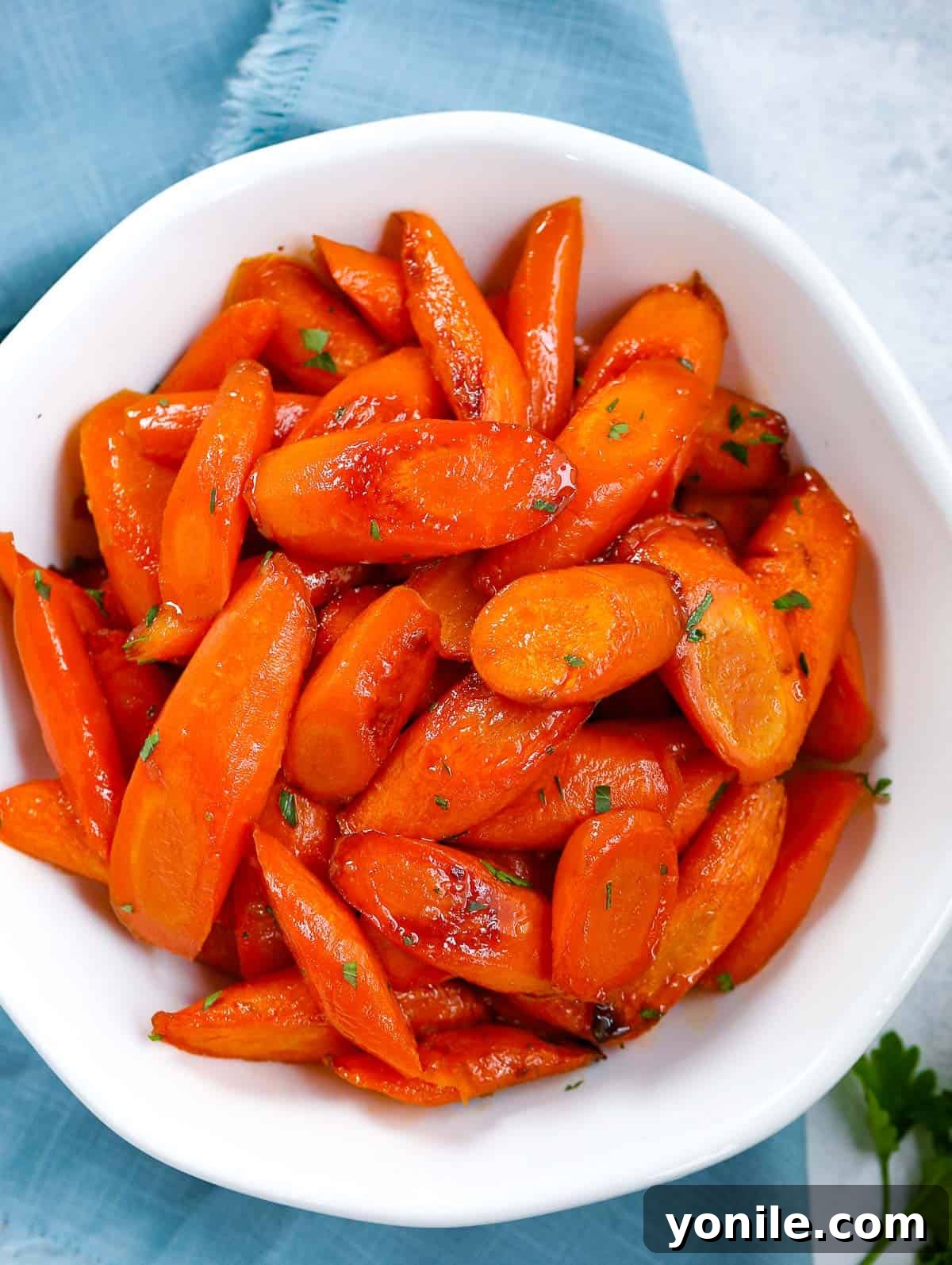 brown sugar glazed carrots on a white bowl, ready to eat