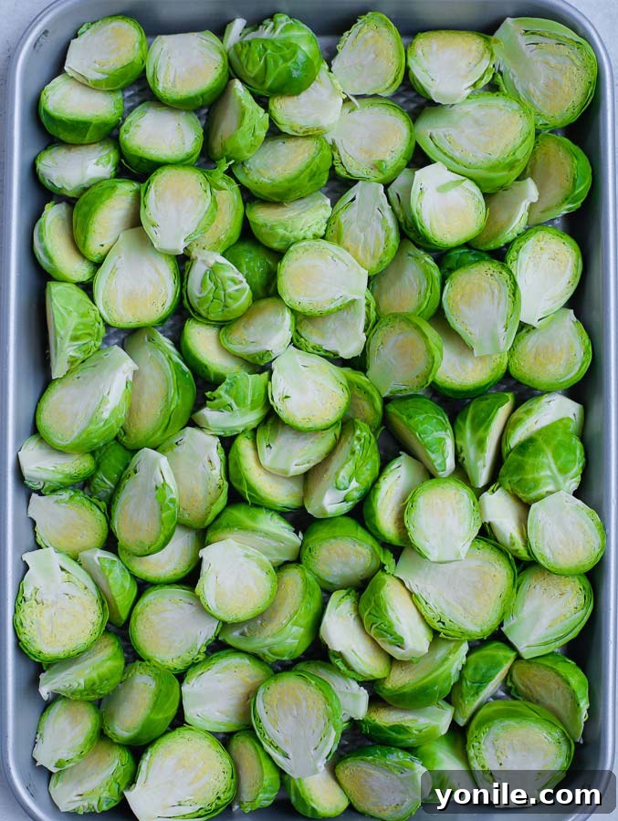 Halved Brussels sprouts coated with seasoning