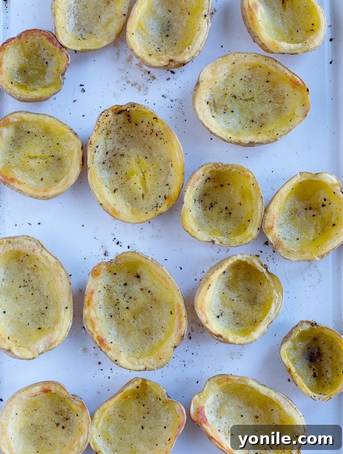 baked potatoes Baked potato skins on a baking tray after first bake