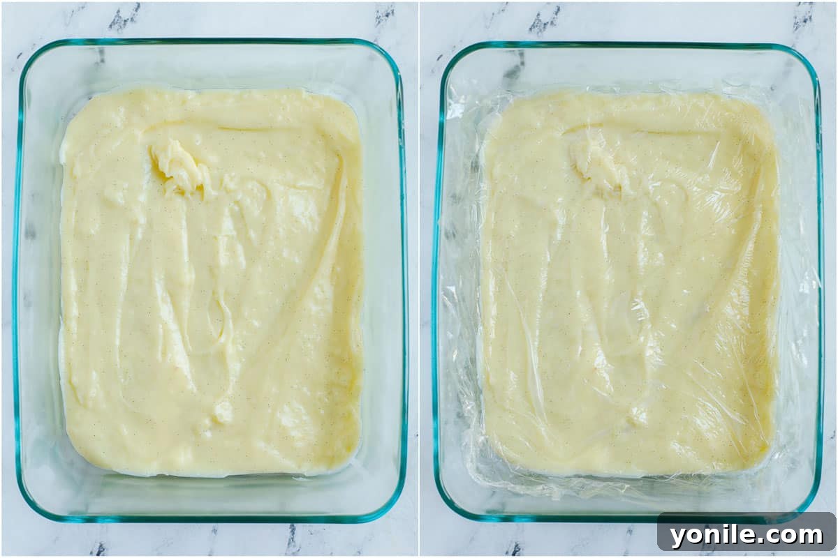 Smooth, chilled crème patissiere in a glass bowl, covered tightly with plastic wrap.