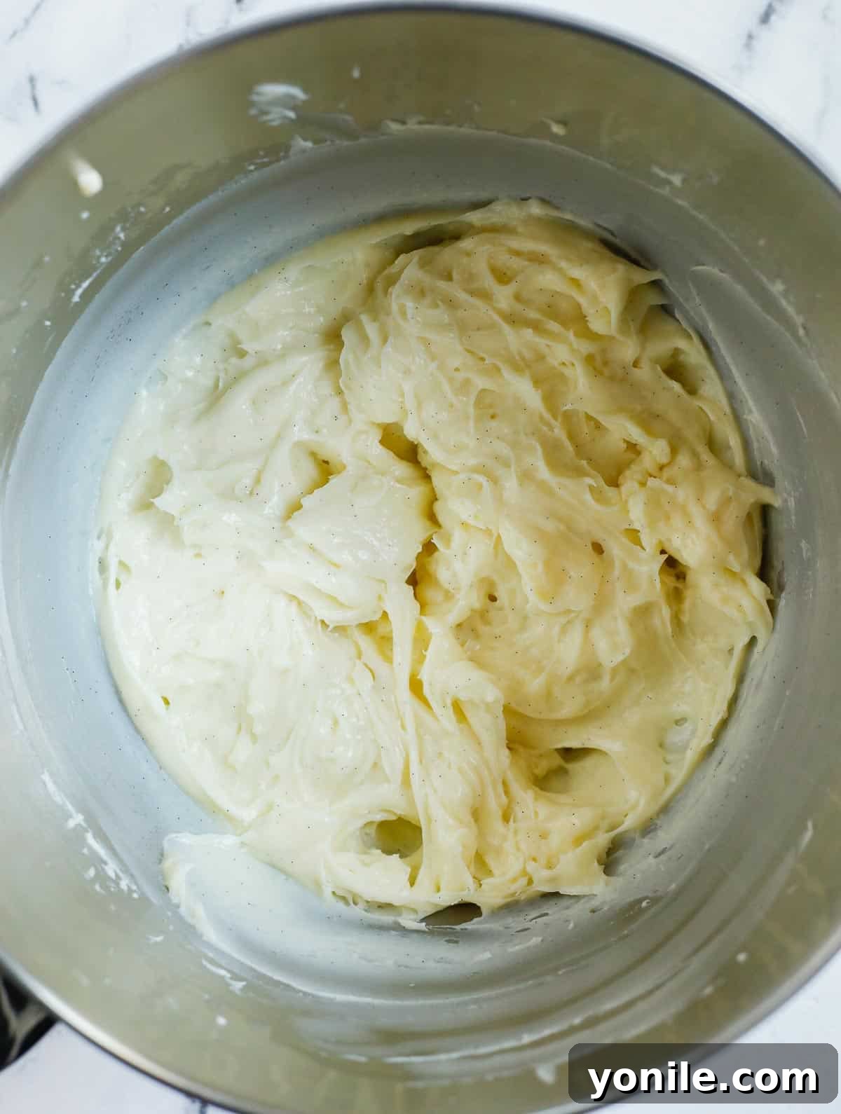 The prepared crème patissiere, after being whipped, displaying a perfectly smooth and creamy consistency.