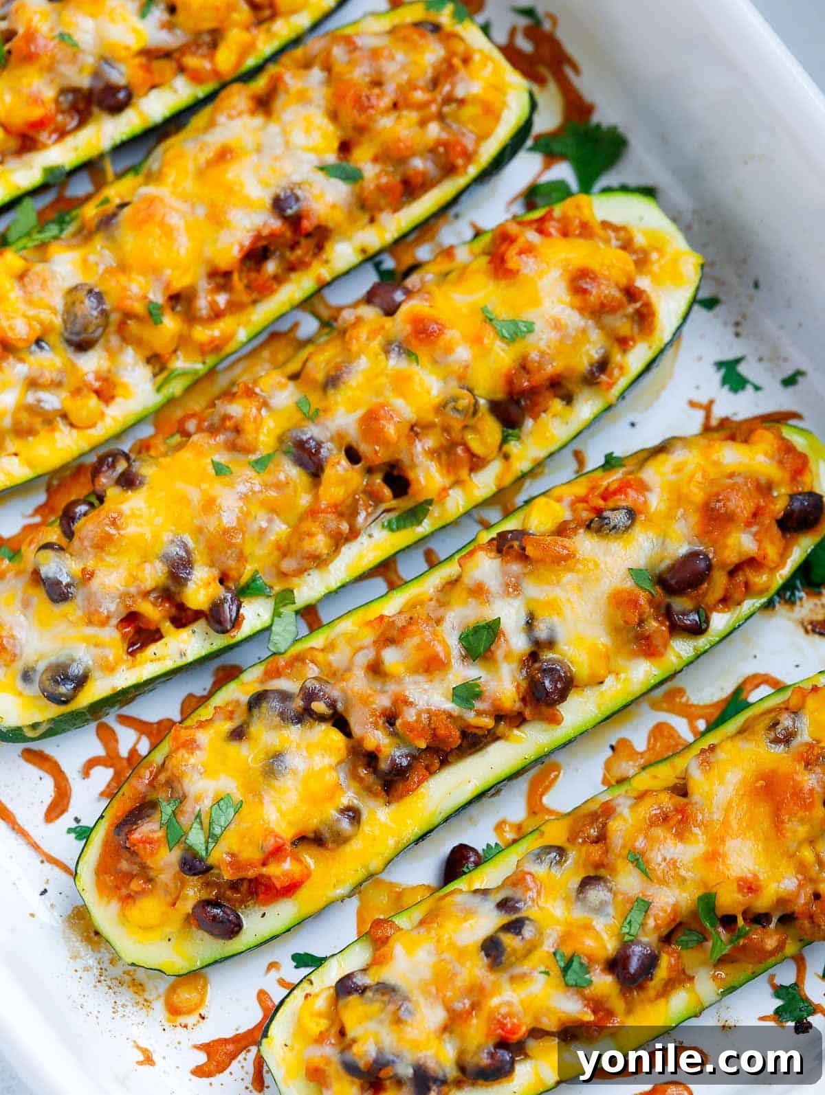 Flavorful zucchini boats in a baking dish, ready to be served
