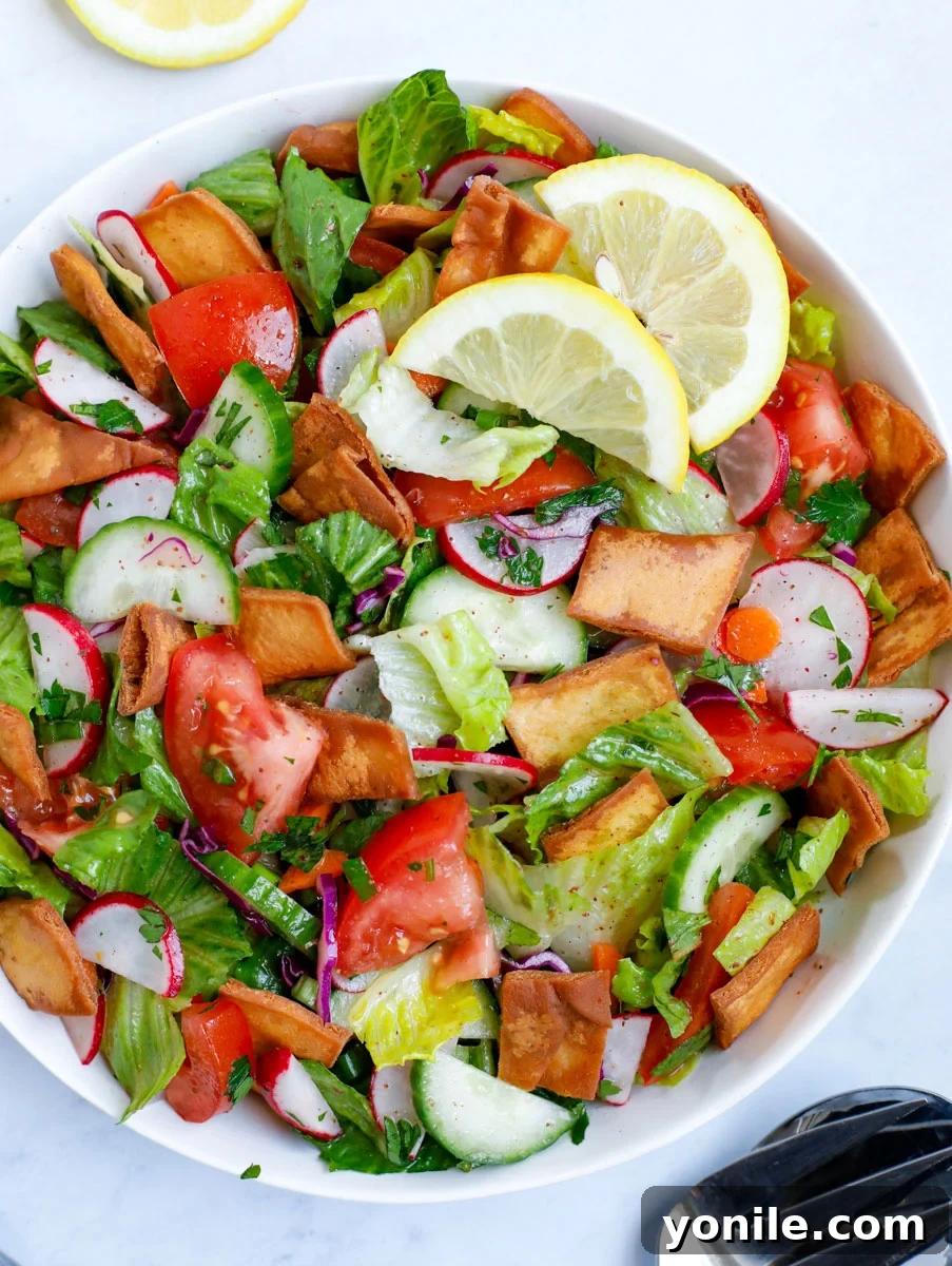 Vibrant Lebanese Fattoush 8 Beautifully presented Fattoush salad in a white bowl, ready to be served.
