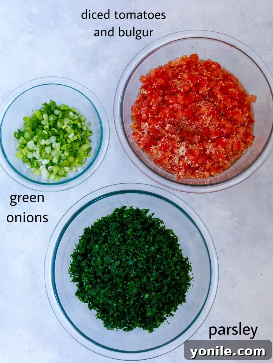 Ingredients for Lebanese tabbouleh salad arranged in three glass bowls