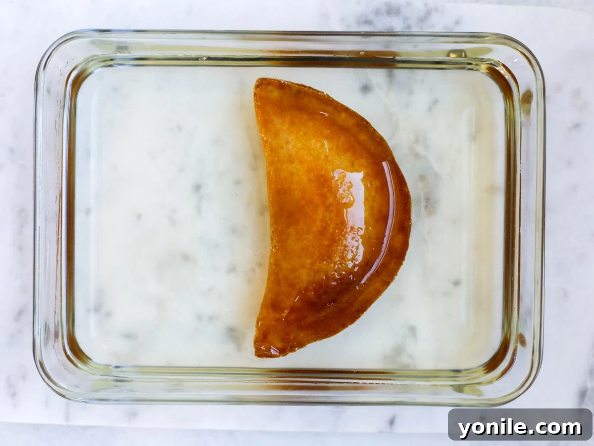 fried atayef dipped in sugar syrup