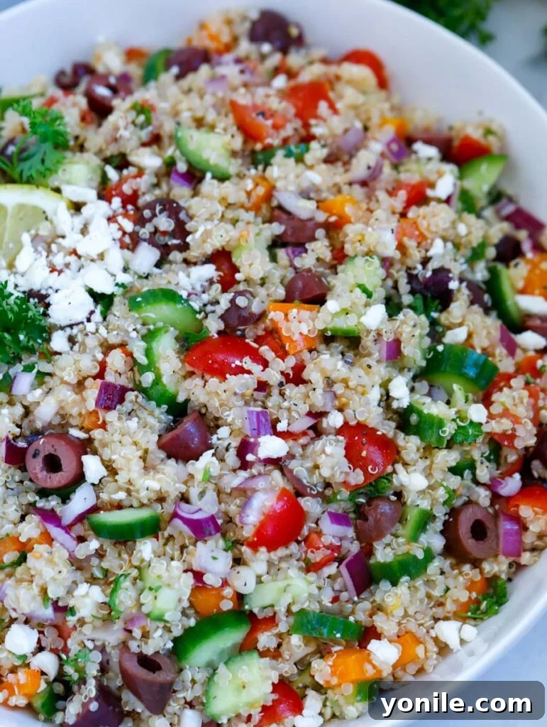 close up shot of the Mediterranean quinoa salad, highlighting the fresh vegetables and quinoa grains