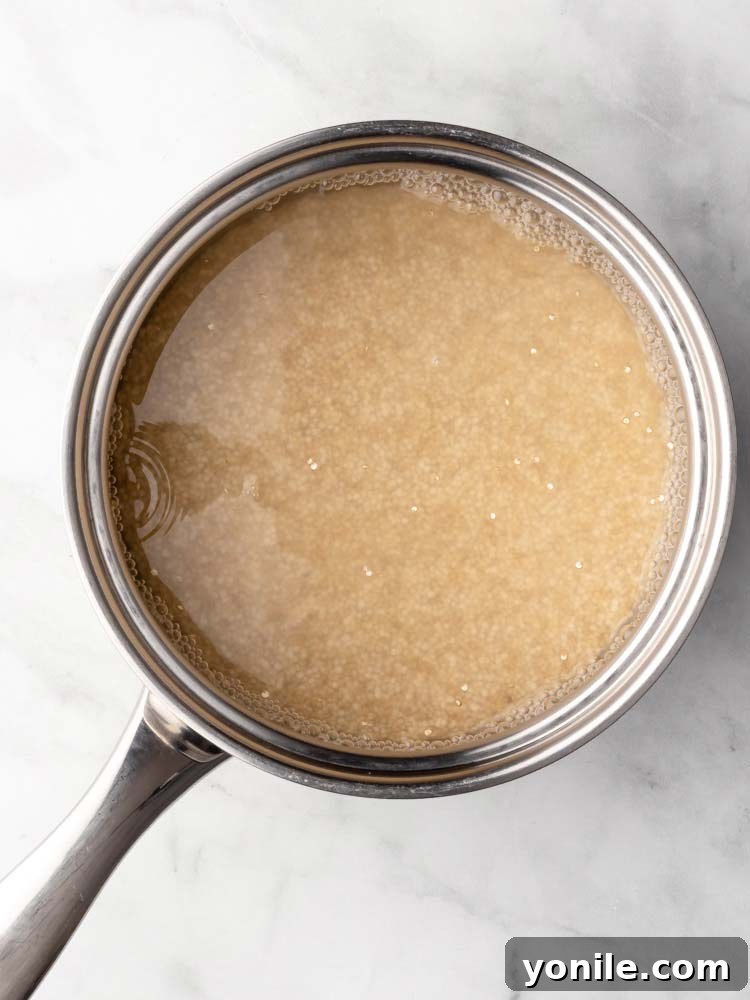 Effortless Fluffy Quinoa 5 cooked quinoa with water in a pot