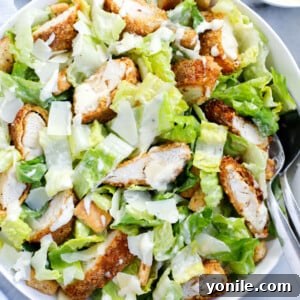chicken caesar salad served in a dish