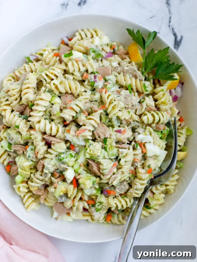 Delicious Tuna Pasta Salad served in a large white bowl, ready to eat.