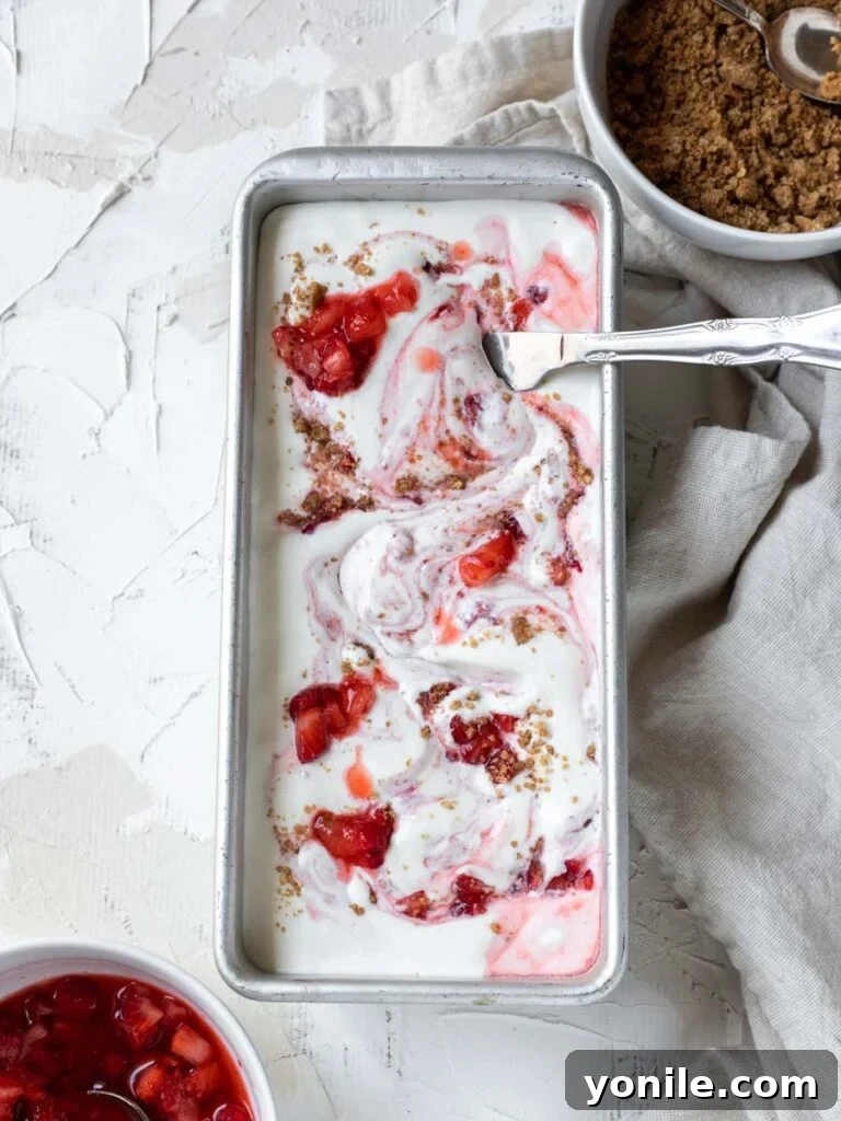 Velvety Strawberry Cheesecake Delight 5 mixing strawberries and ice cream in a pan