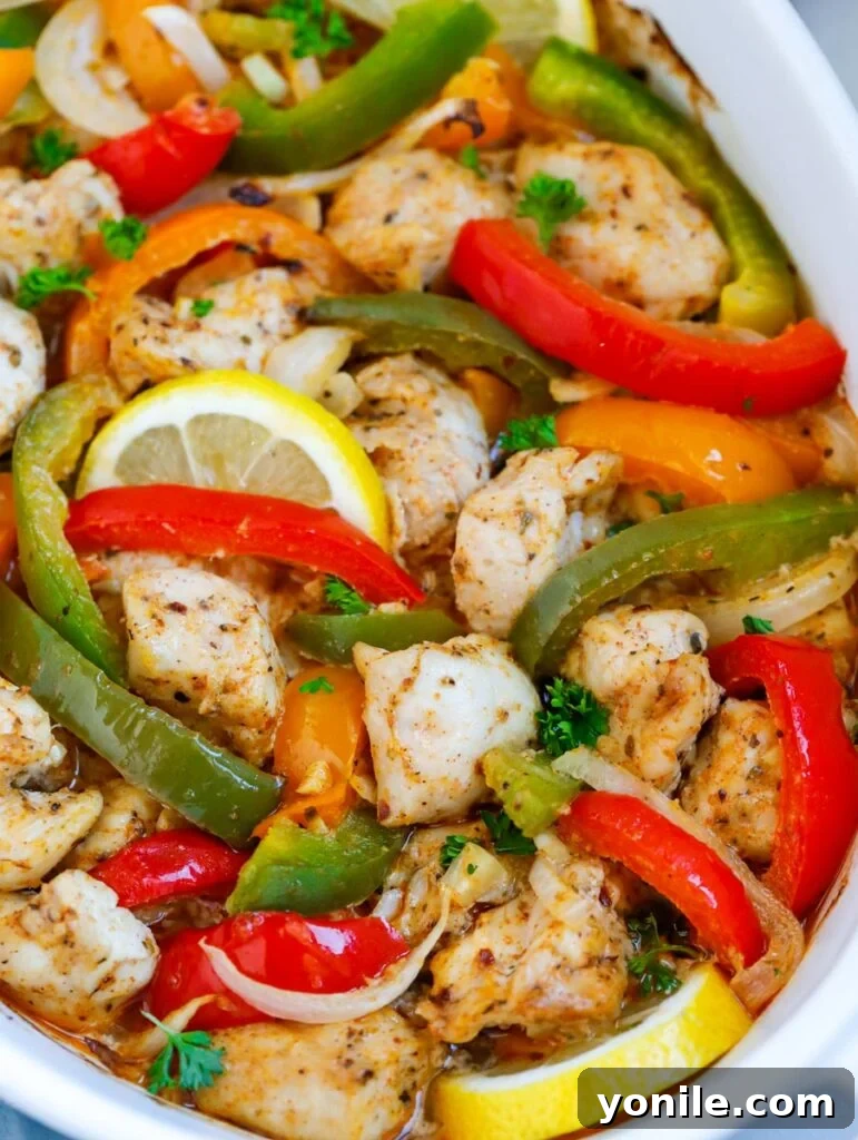Close-up view of the finished Chicken Fajita Bake, showing the juicy chicken and caramelized vegetables.