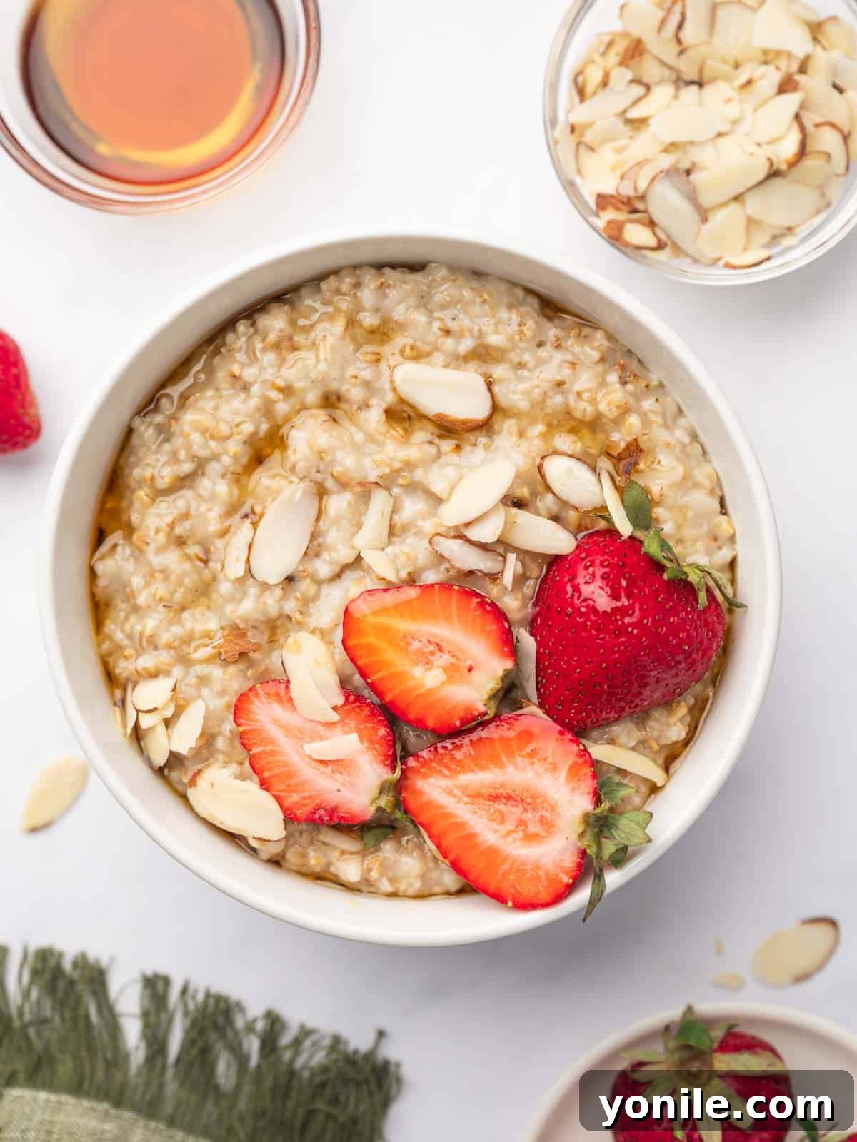 Perfect Oatmeal Every Time 14 instant pot steel cut oats in a bowl topped with strawberries and almonds.