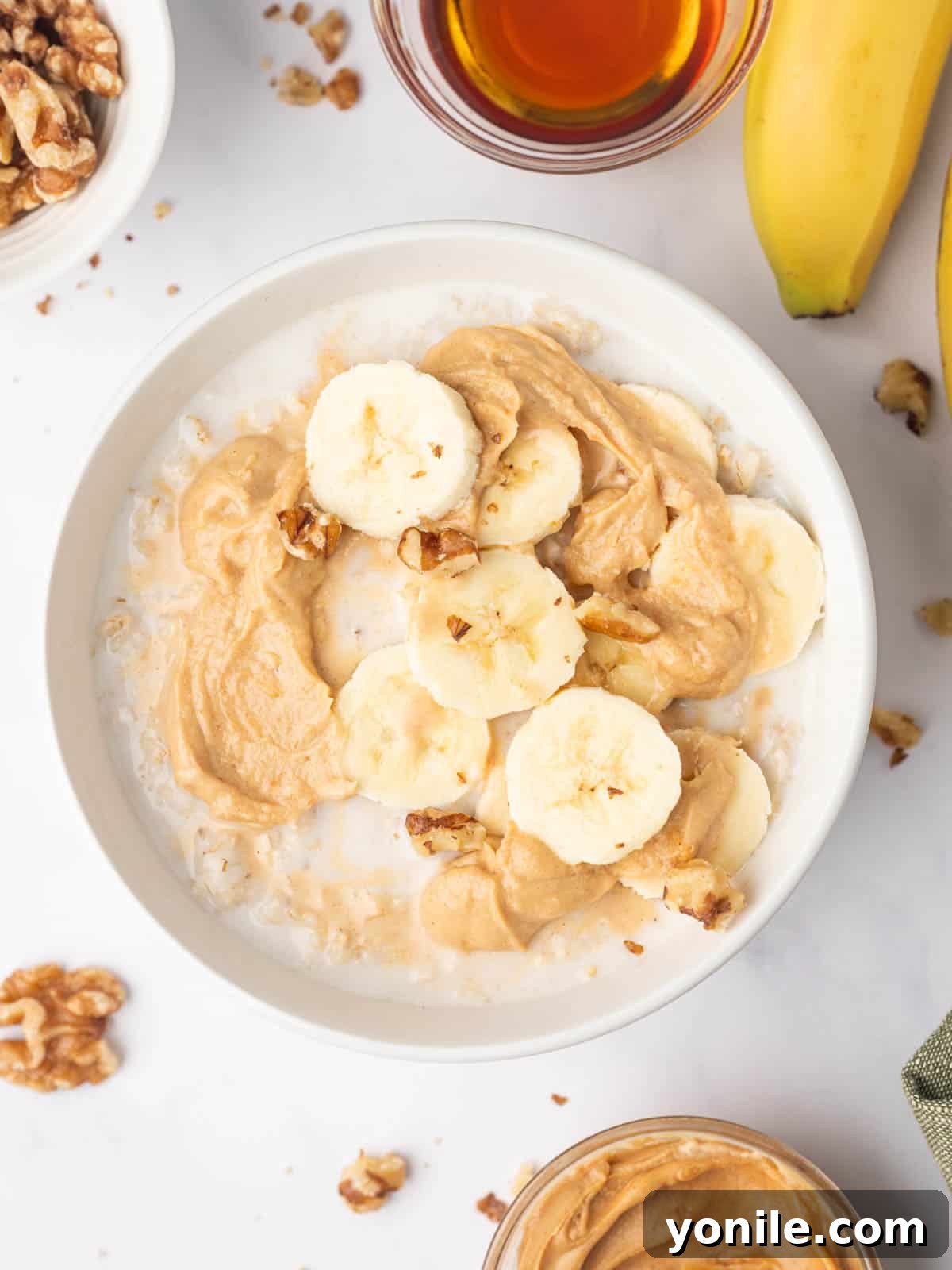 Perfect Oatmeal Every Time 5 microwaved quick oats topped with banans and peanut butter.