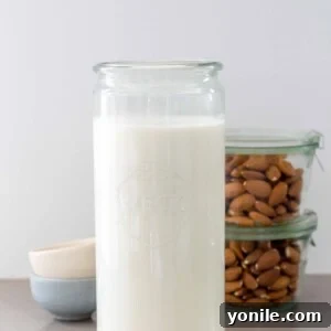 almost milk in a jar with whole almonds in the background