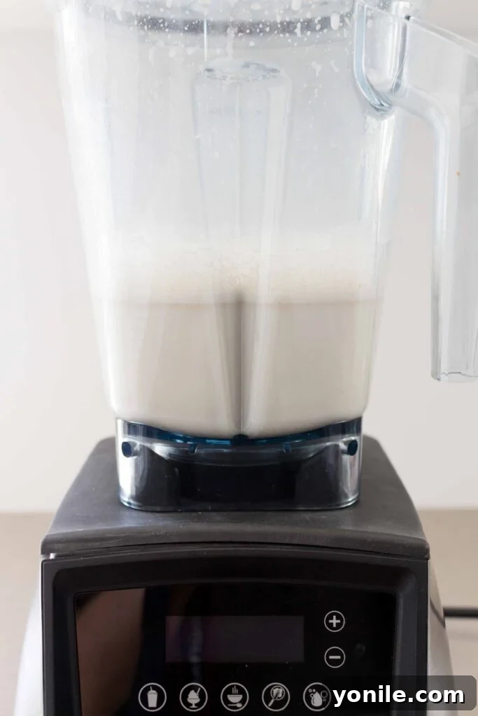Oat milk blending in a Vitamix, showing the creamy texture forming