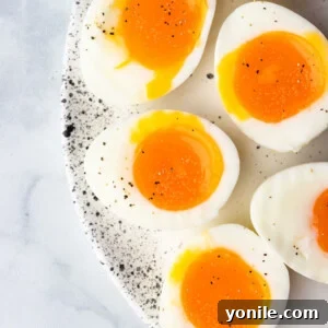 soft boiled eggs cut in half to show the runny yolk center