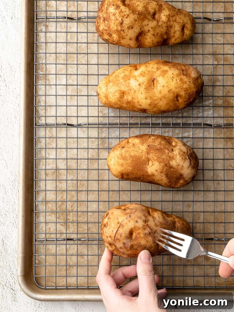 a fork being poked through a potato