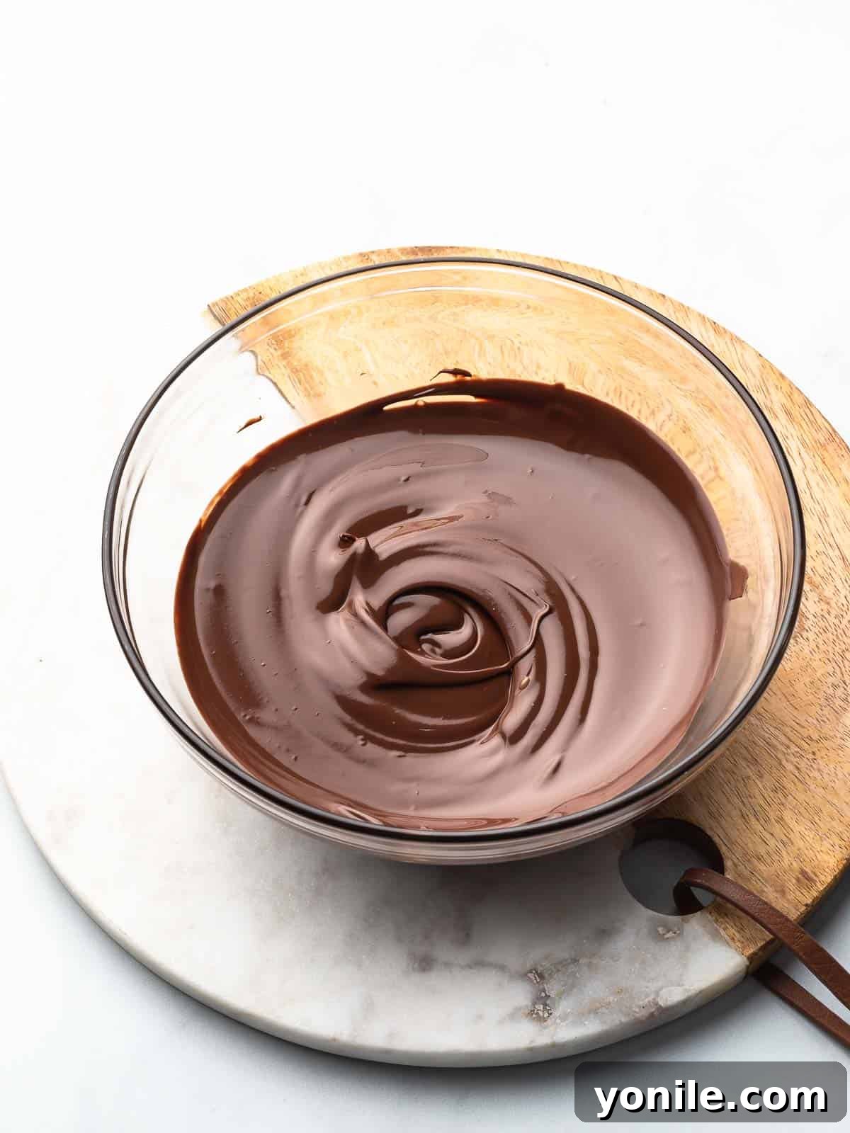 Mastering Chocolate Melting 7 Perfectly smooth and melted chocolate in a microwave-safe bowl, ready for dipping or baking.