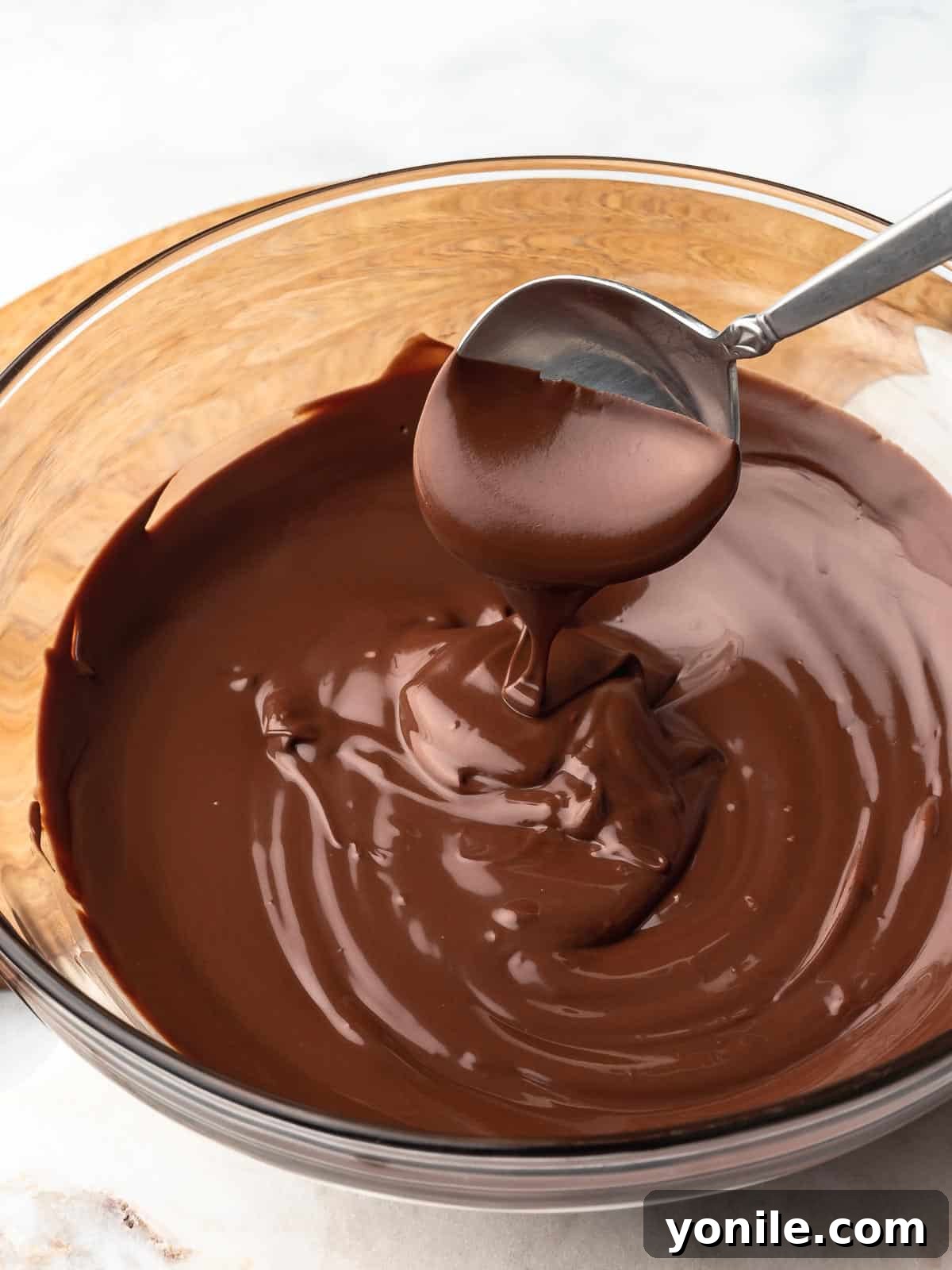 Mastering Chocolate Melting 8 Beautifully melted chocolate in a bowl, ready for any dessert recipe.