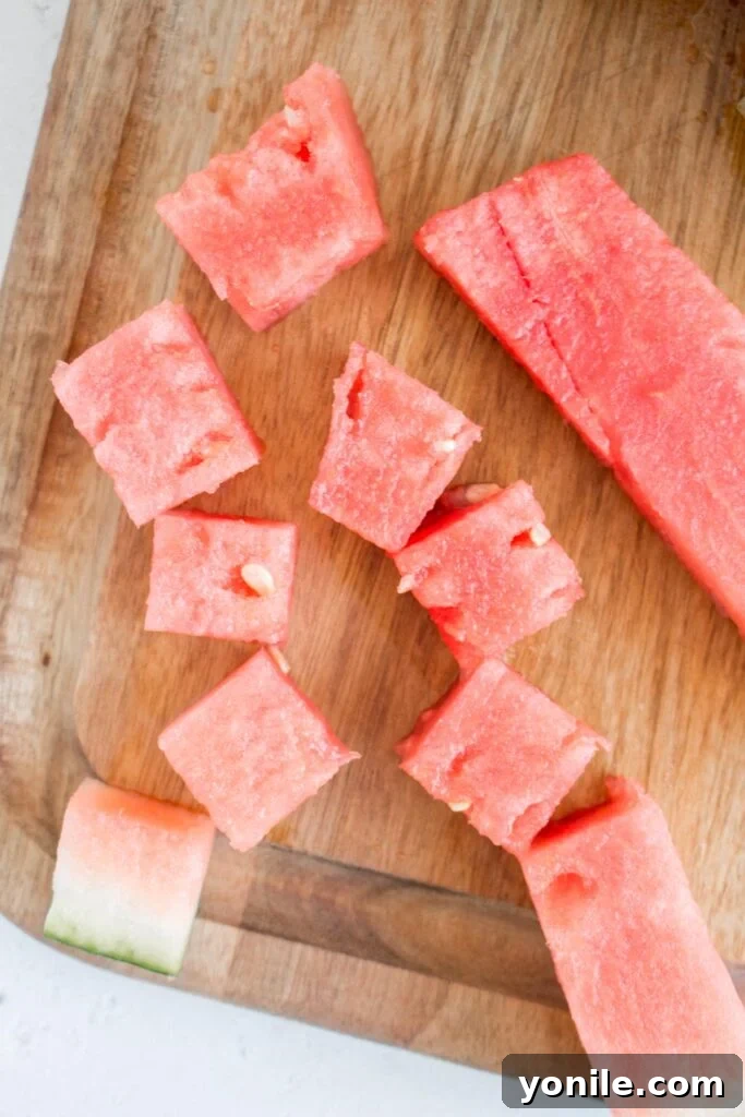 Slice Watermelon Like a Pro 12 A bowl filled with perfectly diced watermelon cubes, vibrant and ready to eat.