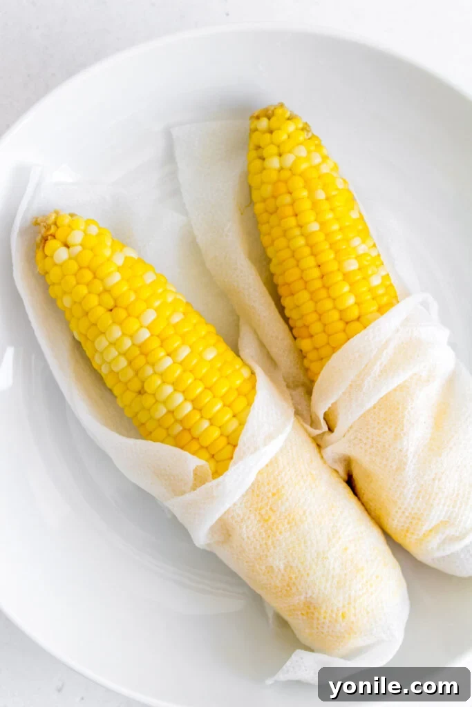 Corn being cooked in a microwave