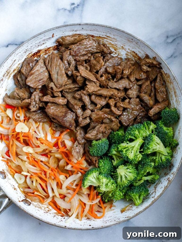 top down shot of Beef and Broccoli Stir Fry in a bowl, freshly cooked