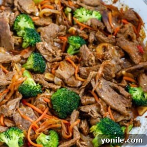 overhead shot of Beef and Broccoli Stir Fry in a white bowl