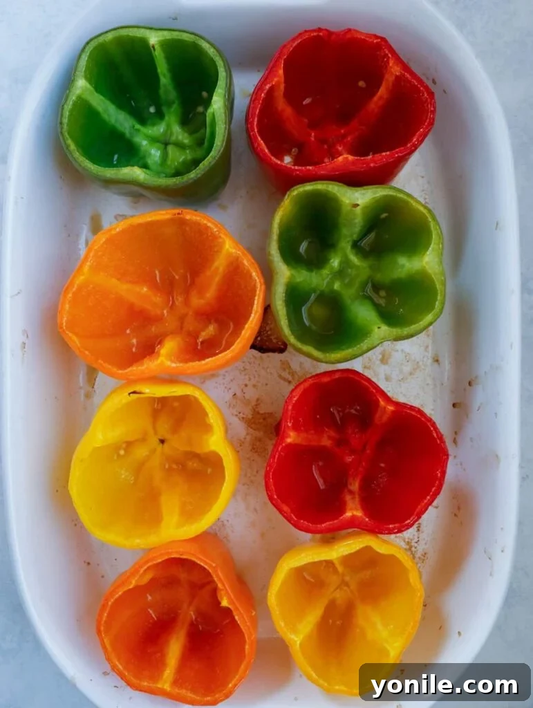 hollowed peppers in a baking dish.
